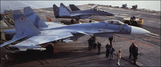 Illustration for article titled Taking Off In A MiG-29K From A Carrier At Night Is A Fiery Thrill
